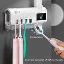 Aplicador de pasta de dente com suporte para dispensador automático de escovas e esterilizador UV.