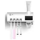Aplicador de pasta de dente com suporte para dispensador automático de escovas e esterilizador UV.
