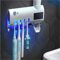 Aplicador de pasta de dente com suporte para dispensador automático de escovas e esterilizador UV.